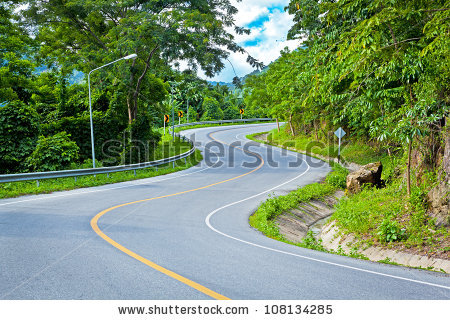 Asphalt road sharp curve along ...